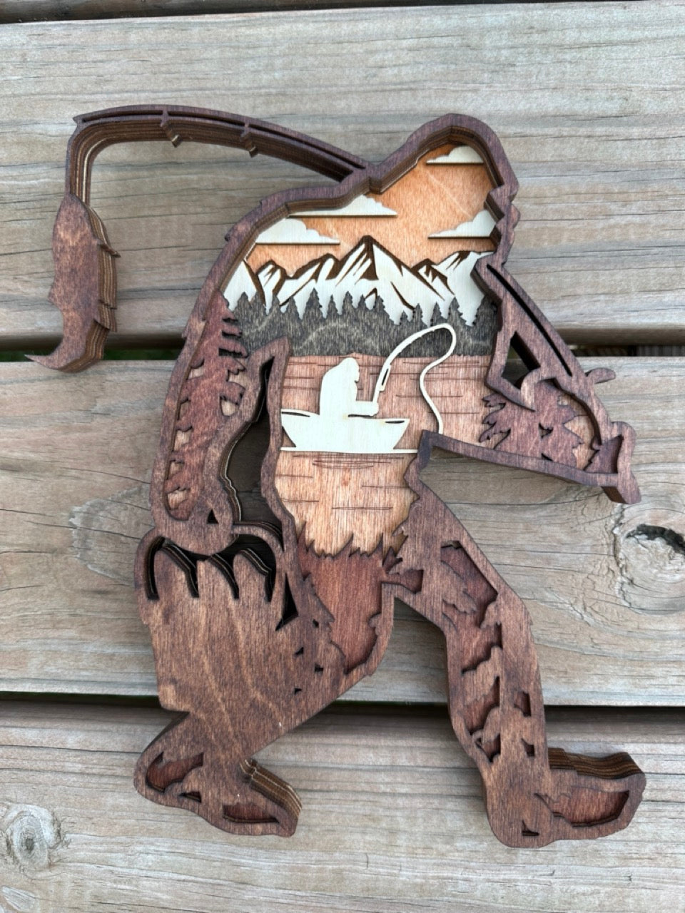 Sasquatchin detail: forest and fishing scene texture showing laser-cut intricacy