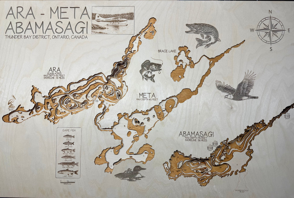 Wooden map of ARA-META ABAMASAGI with laser-cut details and illustrations on a light wood background.