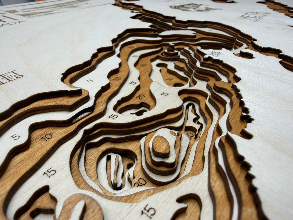 Wooden topographic model of a landscape with contour lines