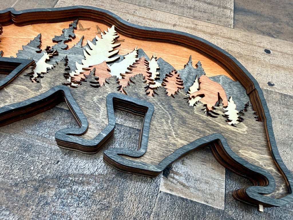 Bear and Company detail: precision cuts showcase the dimensional craftsmanship in each wood layer