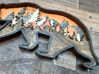 Bear and Company detail: precision cuts showcase the dimensional craftsmanship in each wood layer