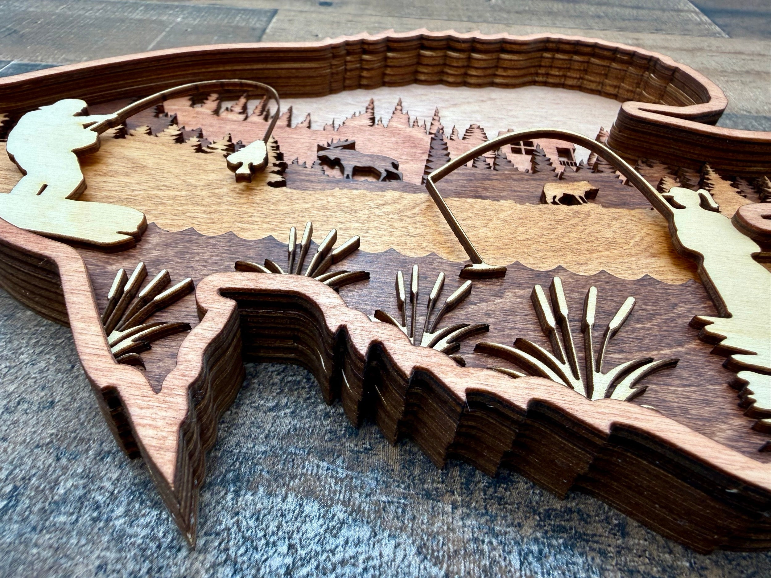 Crappie detail: layered wood craftsmanship showing fine laser-cut precision