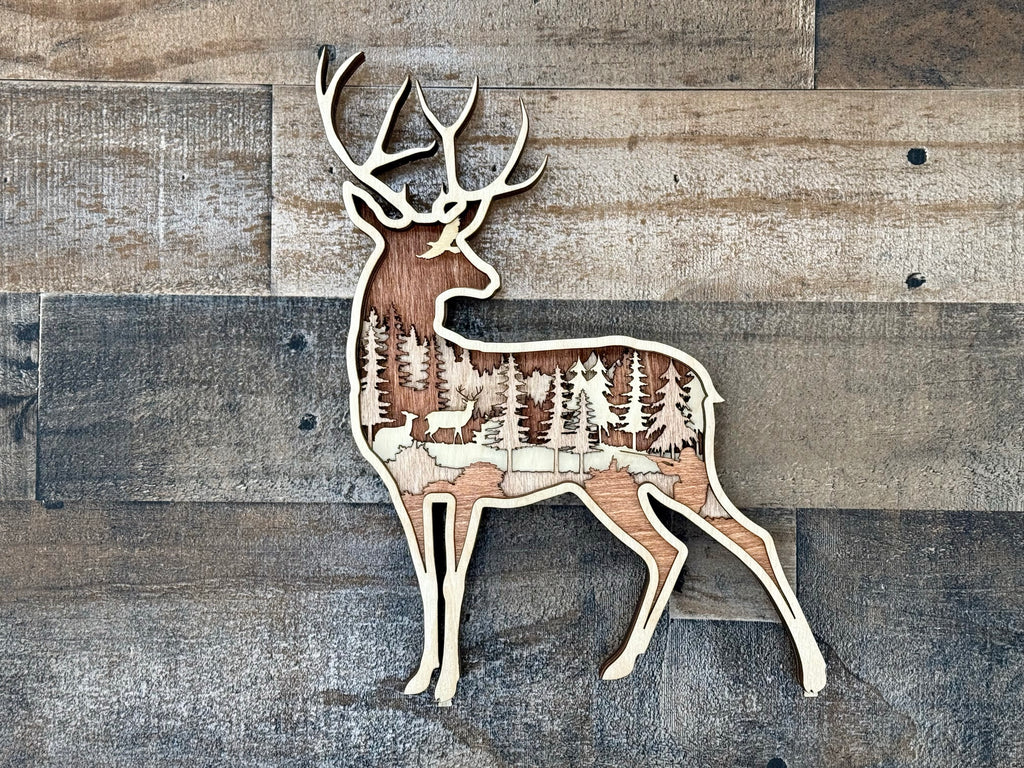 Two deer alert in a dense forest with hunter and eagle overhead – multilayer laser cut wood art by Laser Lakes