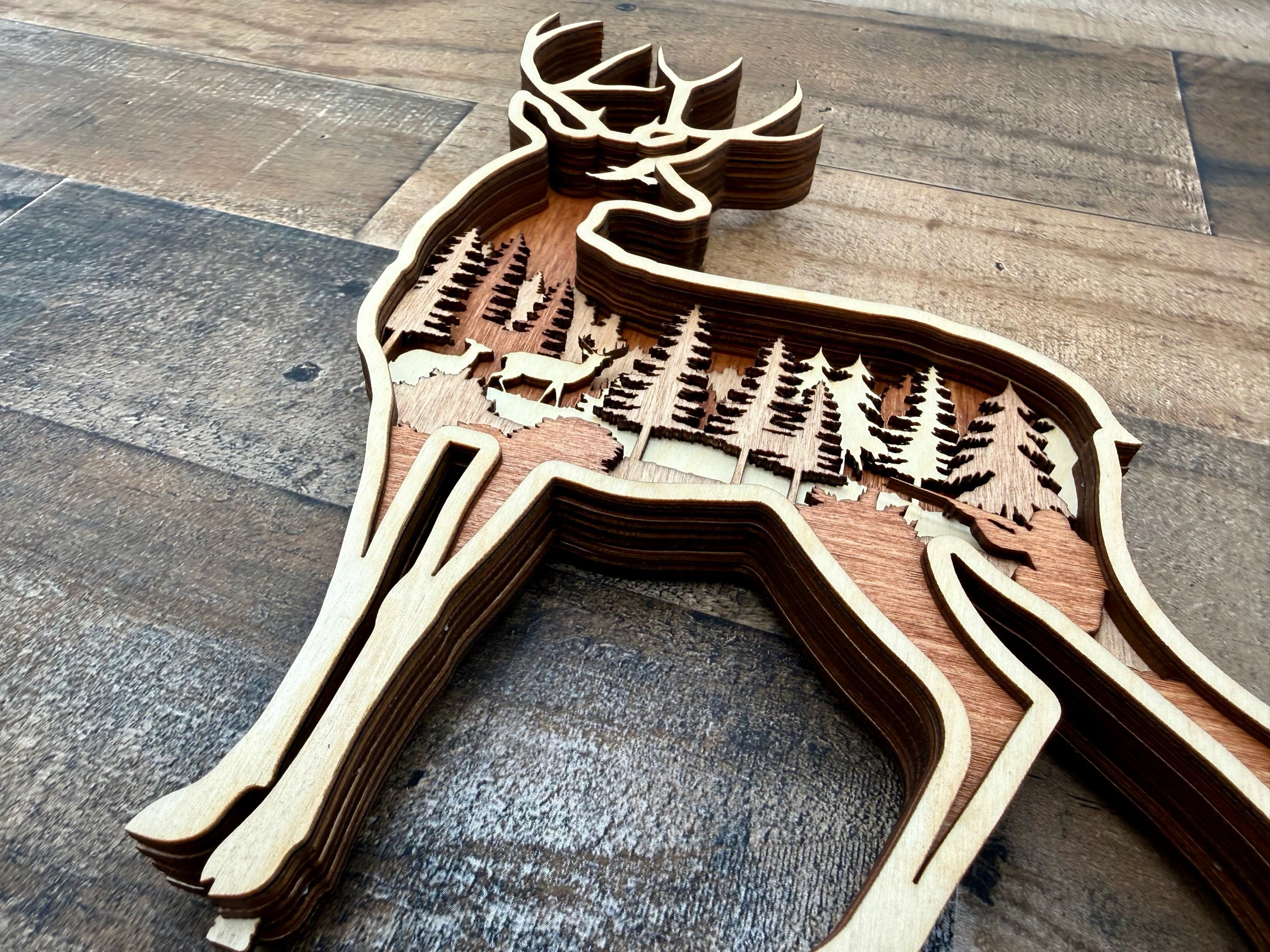 Deer in the Woods detail: layered wood showing depth and dimensional precision