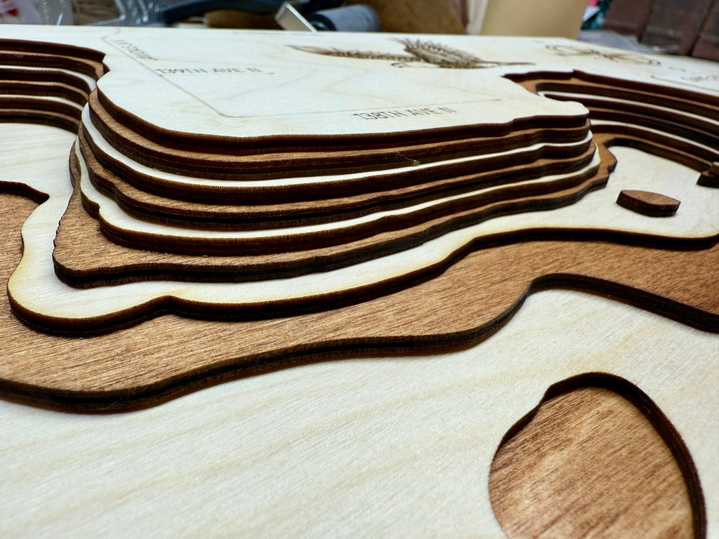 Diamond Hennepin detail: dimensional wood layers