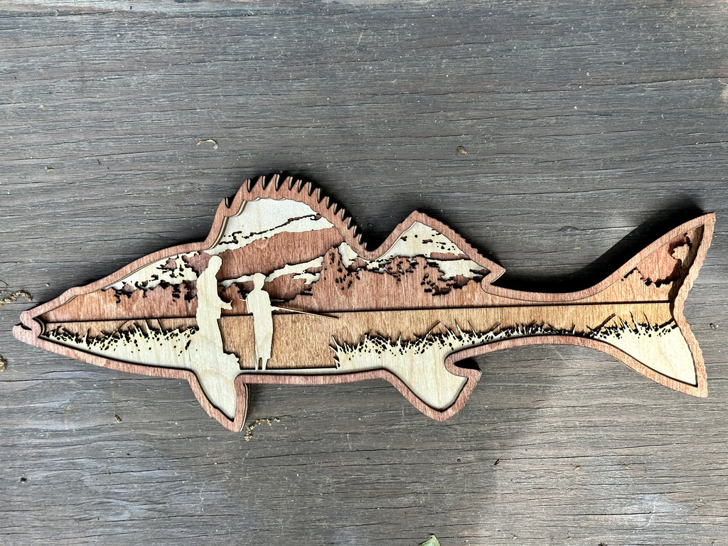 Parent and child fishing peacefully as clouds drift overhead – laser cut wood art by Laser Lakes