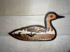 Loon detail: intricate laser cuts showing the bird's distinctive markings