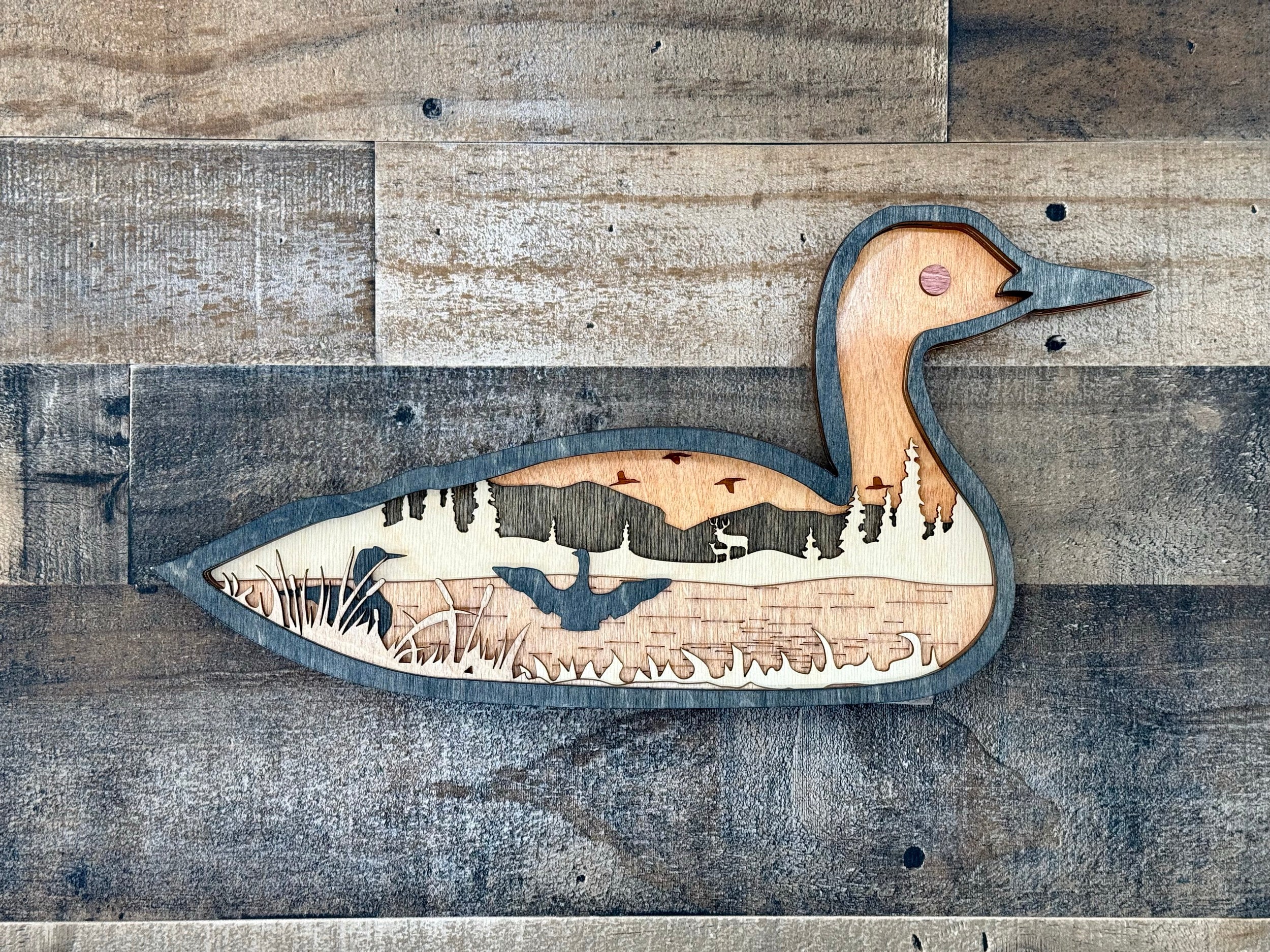 Loon singing to the moon – Minnesota's iconic state bird in laser cut wood art by Laser Lakes