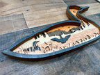 Loon detail: close-up of precision laser cuts in Baltic Birch layers