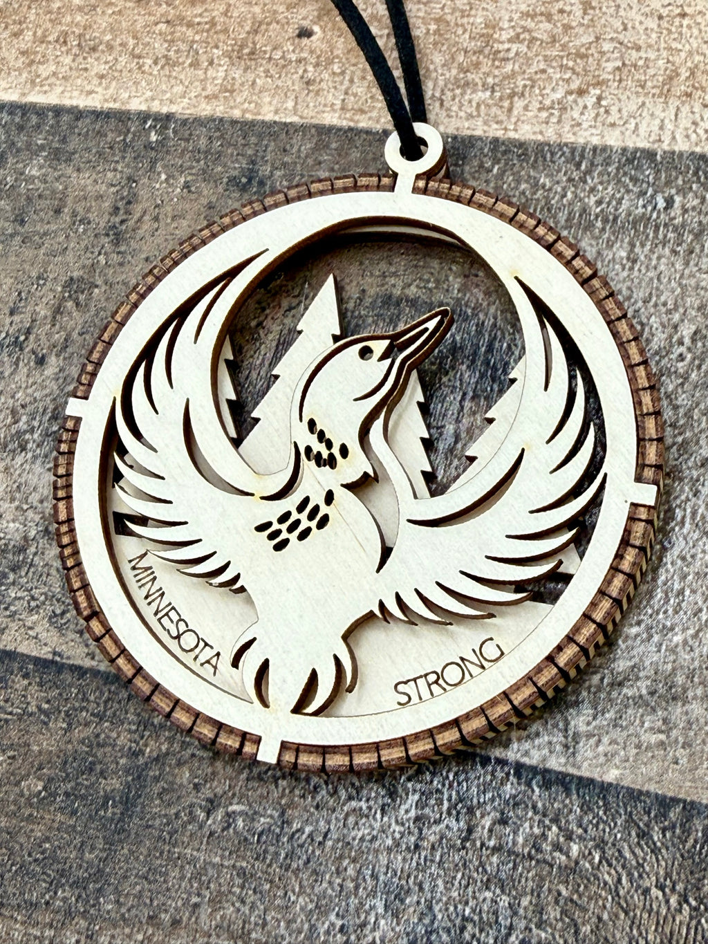 Minnesota Strong Ornament detail showing laser-engraved loon bird design