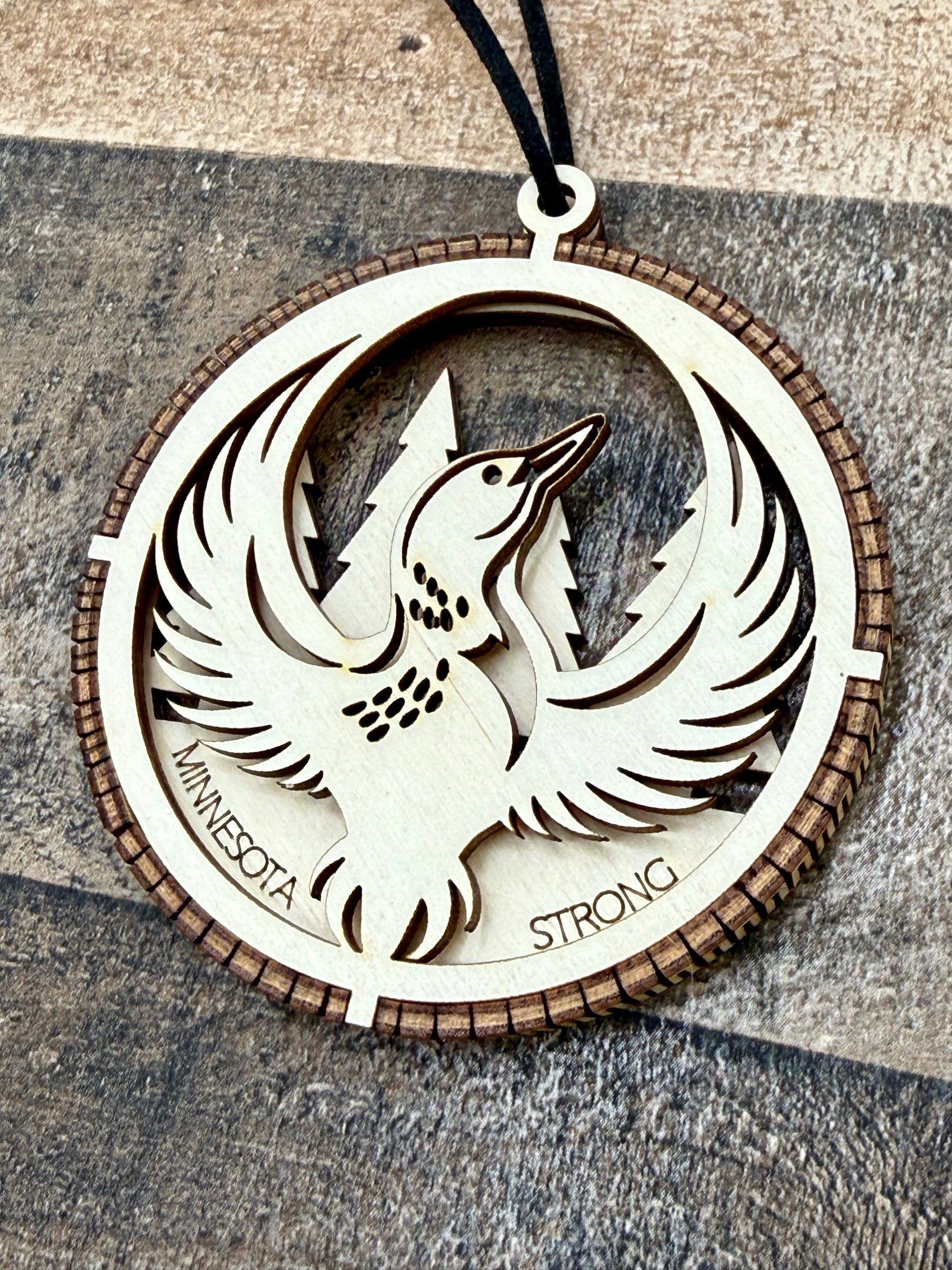 Minnesota Strong Ornament detail showing laser-engraved loon bird design