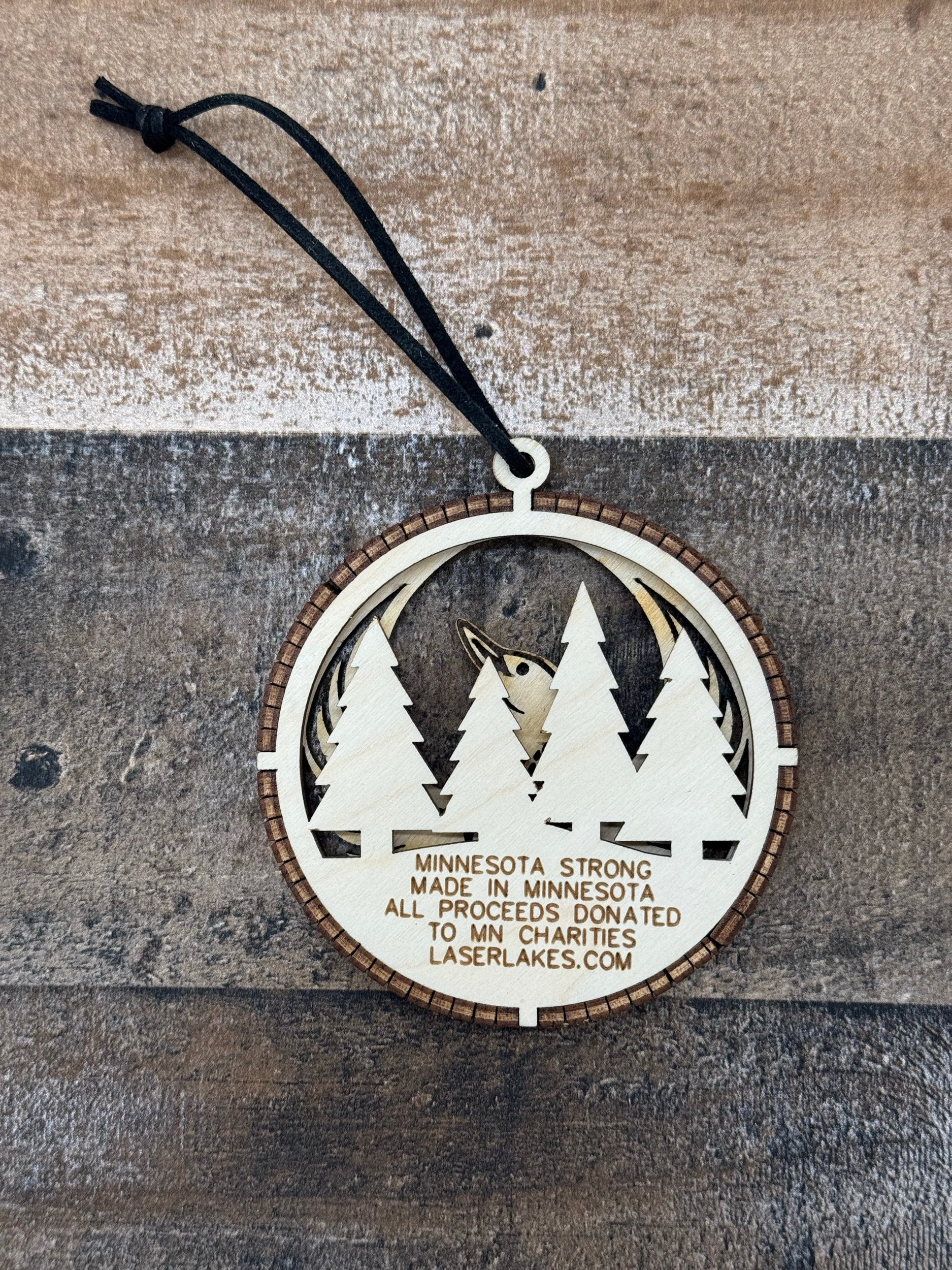 Minnesota Strong Ornament detail view of laser-engraved wood ornament