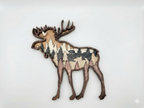 Moose and Bear detail: fine laser-cut detail showing the animals and forest texture