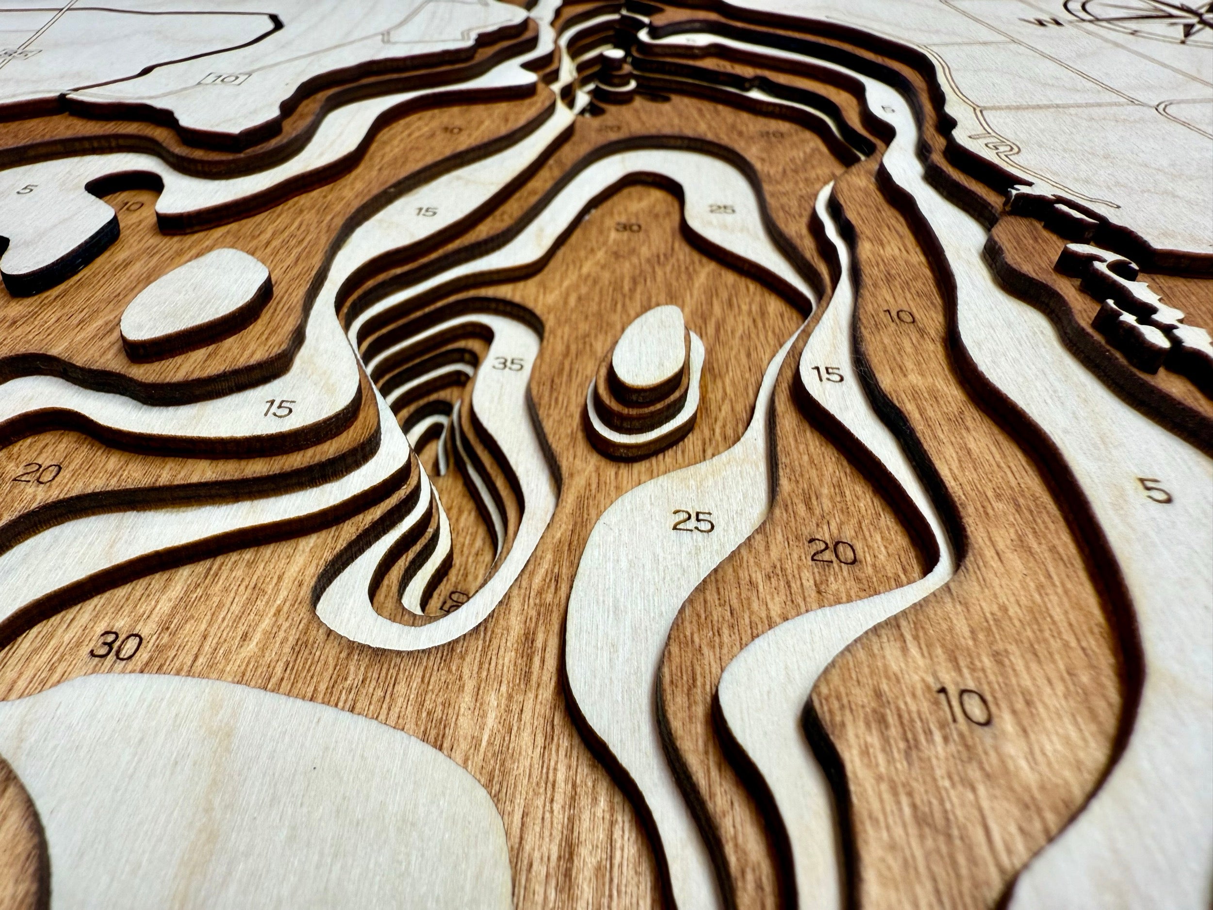 Osakis Lake topographic map showing laser-engraved depth contours in wood