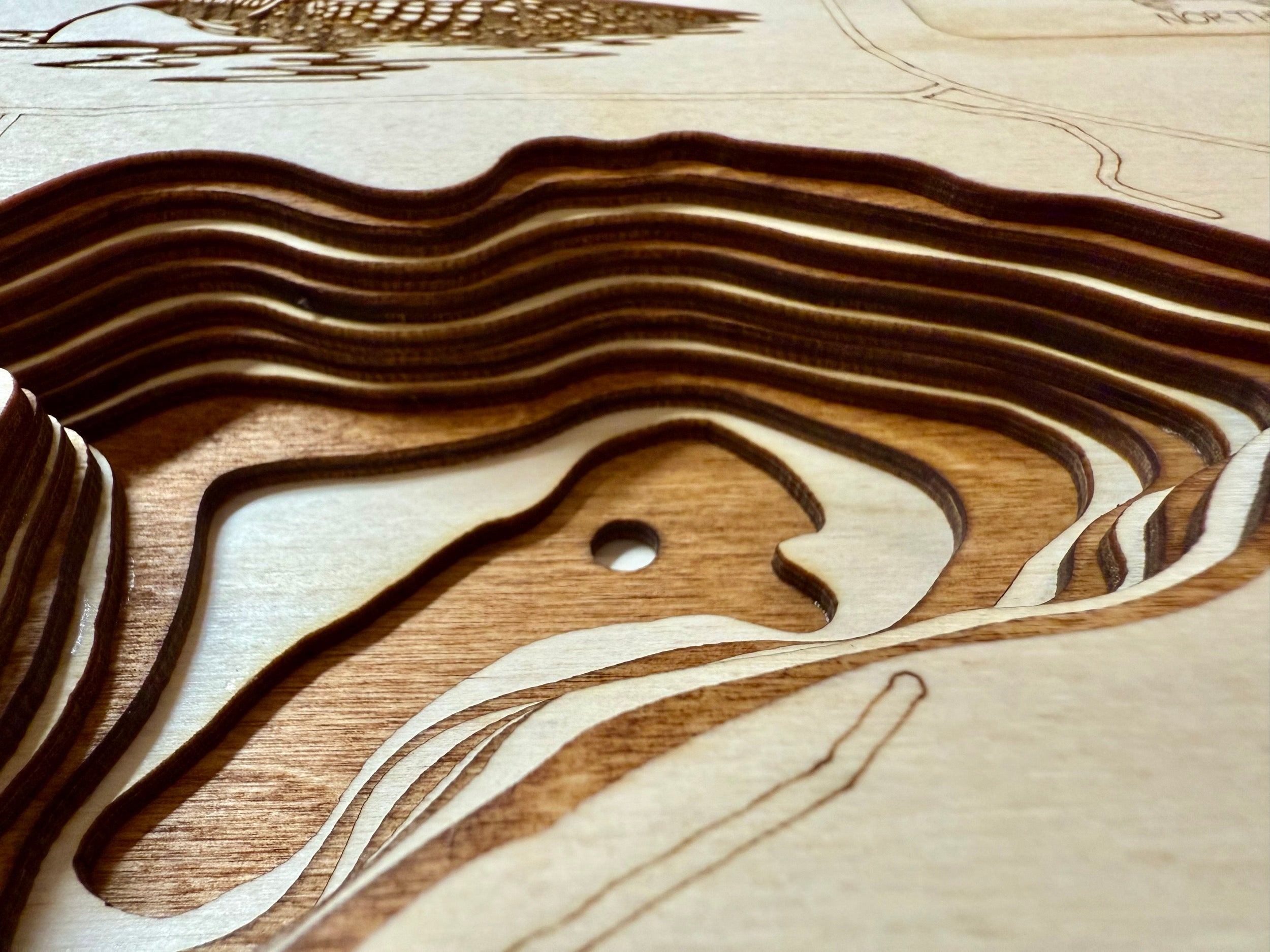 Ossawinnamakee Lake wooden laser-cut topographic map detail with elevation contours