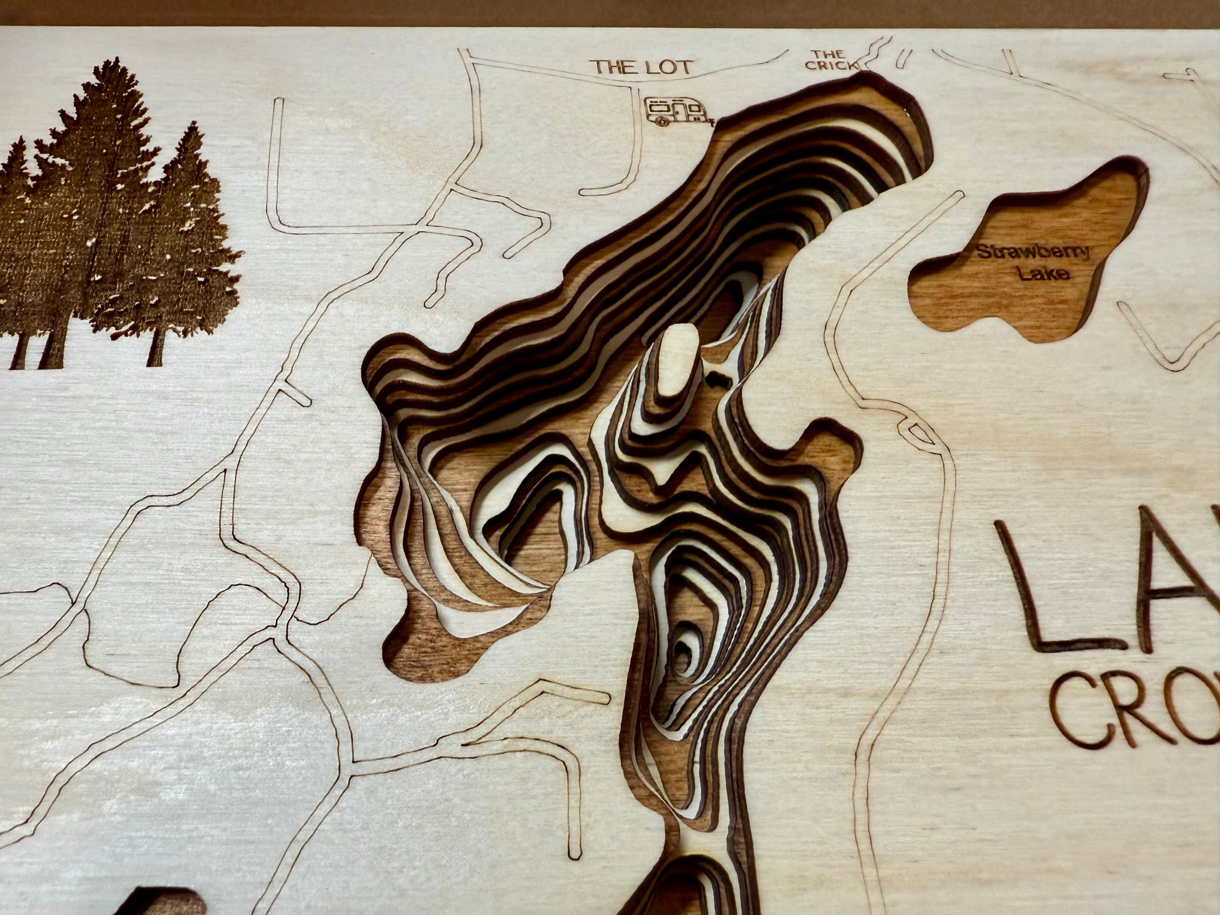 Ossawinnamakee Lake topographic map detail showing laser-cut depth contours in wood