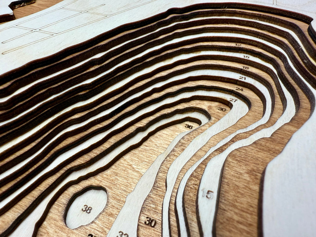 Owasso Lake topographic map showing laser-engraved depth contours in wood