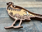 Pheasant Present detail: forest and sky detail showing precision laser work