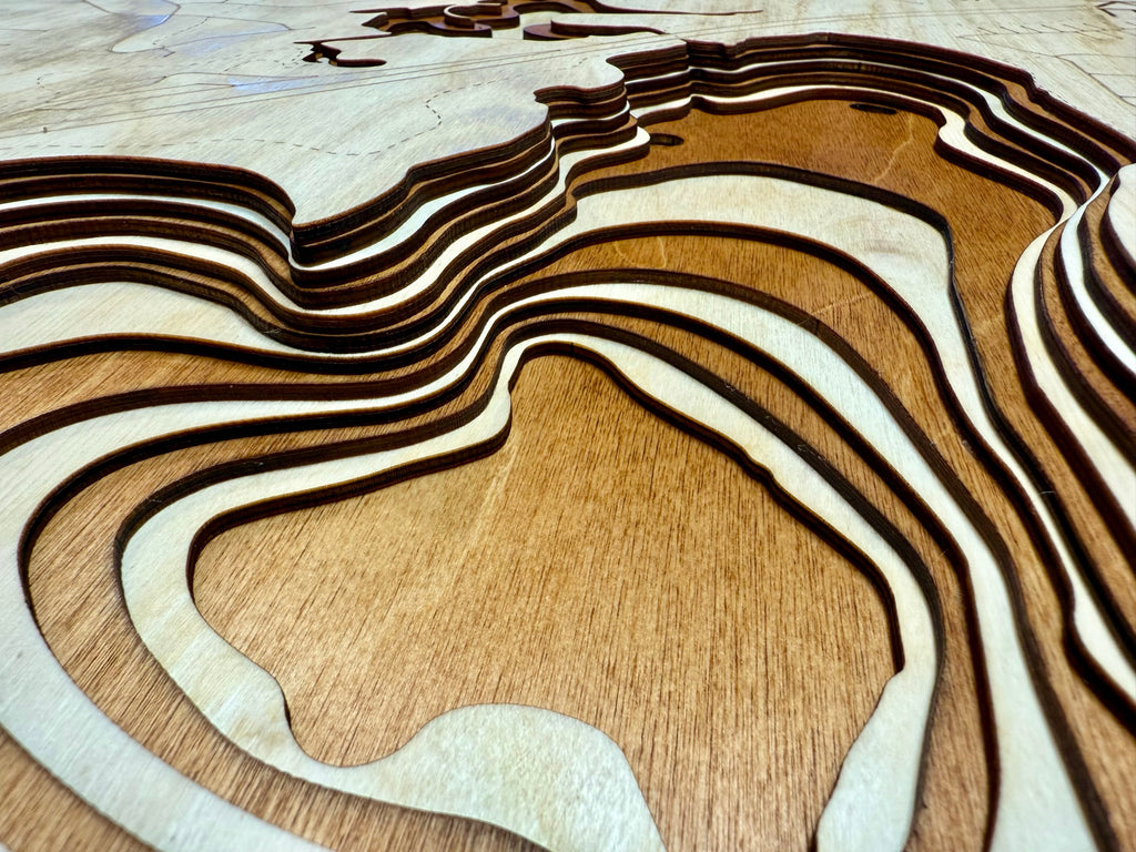 Rice Lake topographic map showing laser-engraved depth contours in wood