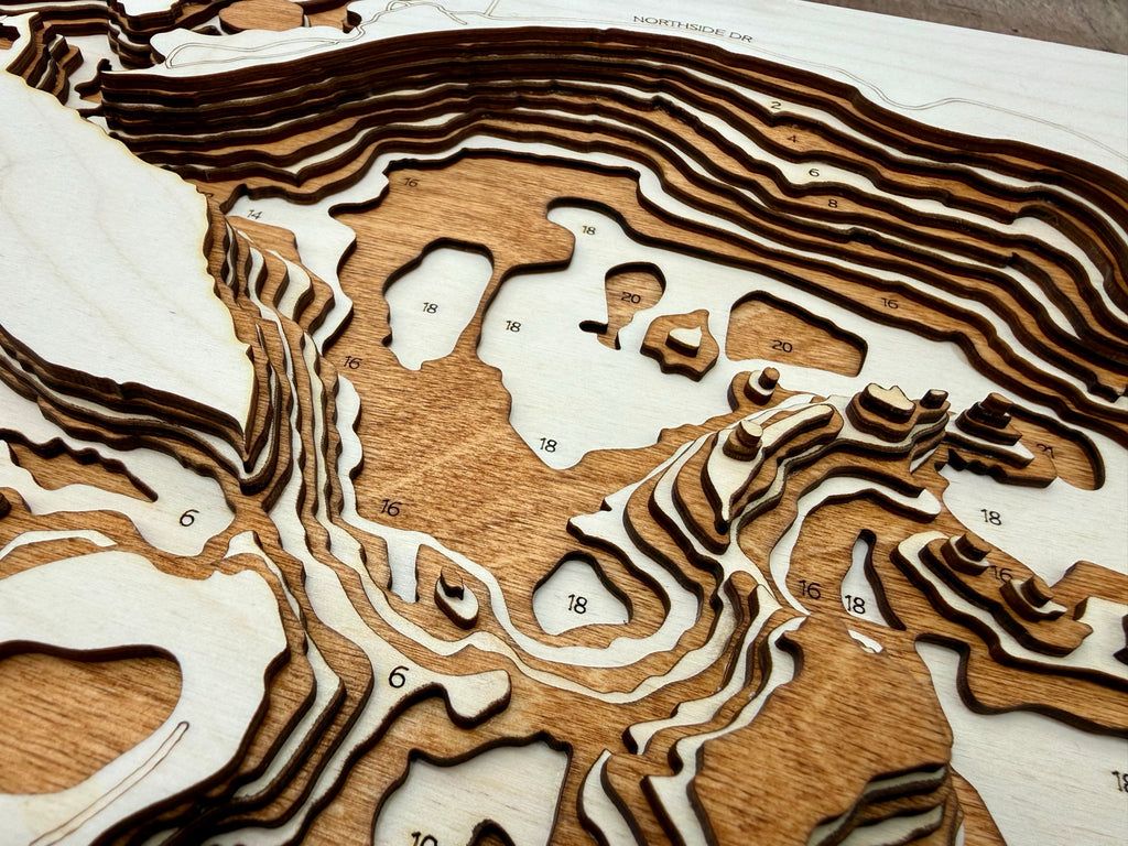 3D wooden laser-cut topographic map of Roy Lake South Dakota with depth contours and layered wood relief art