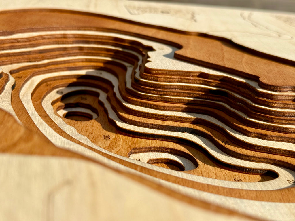 Turner Lake topographic map showing laser-engraved depth contours in wood