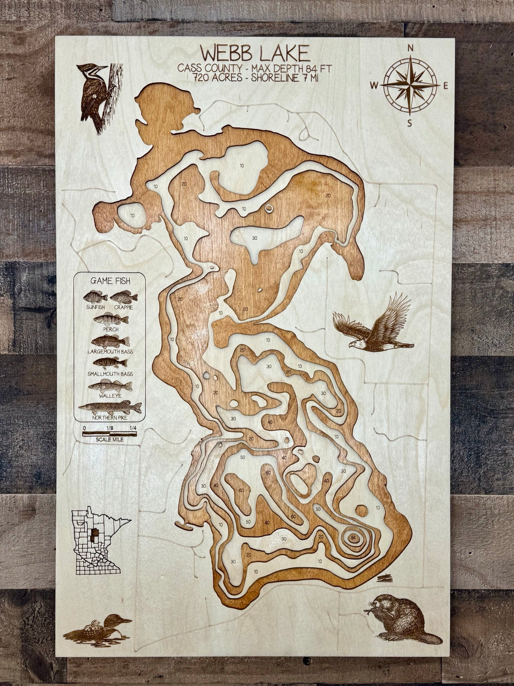 Webb Lake Cass County Minnesota layered wood laser engraved topographic map with depth contours and wildlife engravings