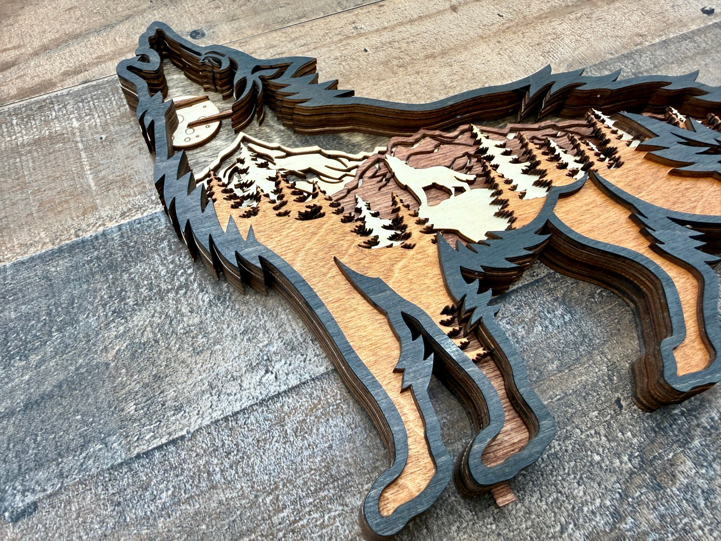 Wolf Song Dark dark wood laser-engraved light sculpture with layered relief wolf art