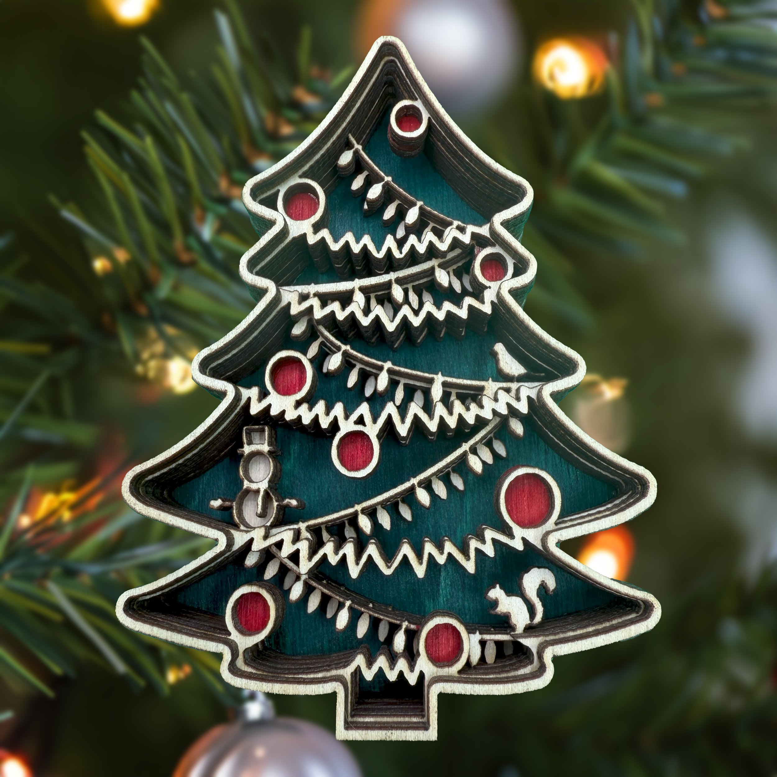 Christmas tree in a tree with string lights – laser cut ornament by Laser Lakes