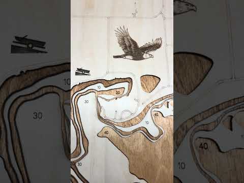 Wooden topographic model of a lake with depth details